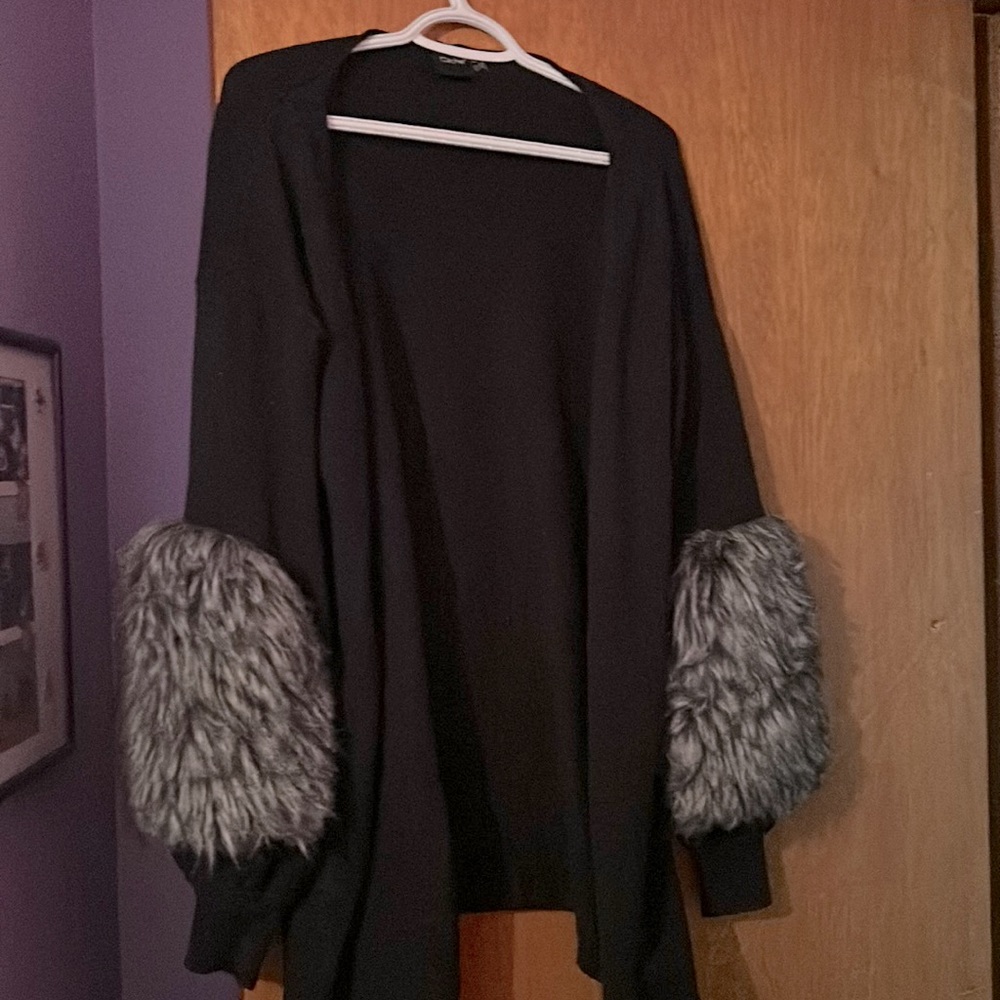 Cliche cardigan with fur bottom sleeves.